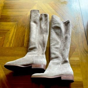 Knee high suede boots.